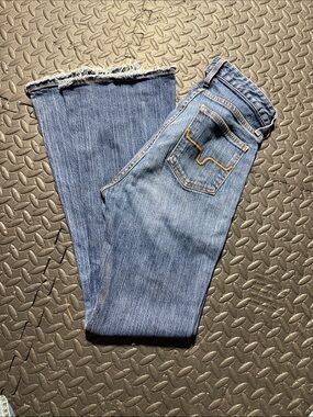 Women's Mid-Blue Bootcut Jeans cut cuff off still fits 32” maybe a 31”